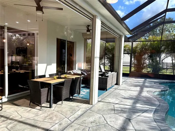 a view of a lobby with a tables and chairs