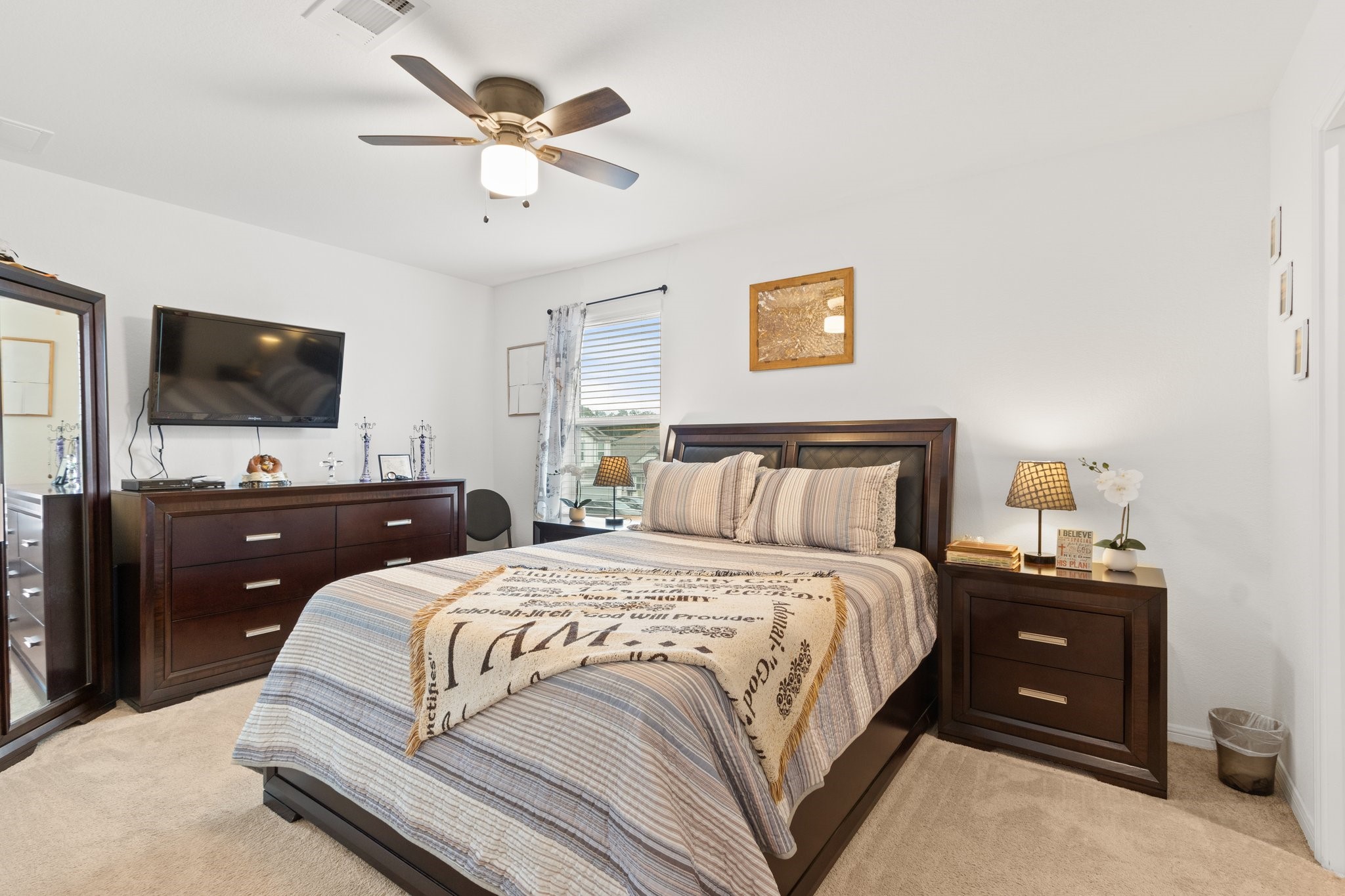 5834 Finely Run St Spring Spring, TX 77373 - Photo 27 of 50 a bedroom with a bed and a flat screen tv
