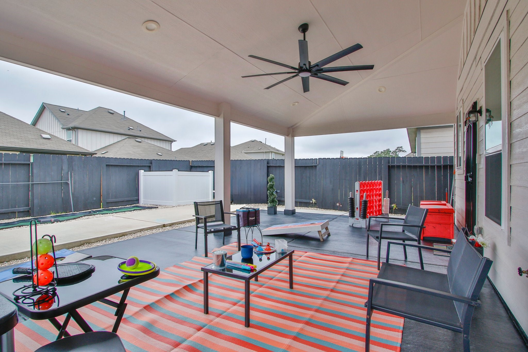 5834 Finely Run St Spring Spring, TX 77373 - Photo 34 of 50 a living room with furniture and kitchen view