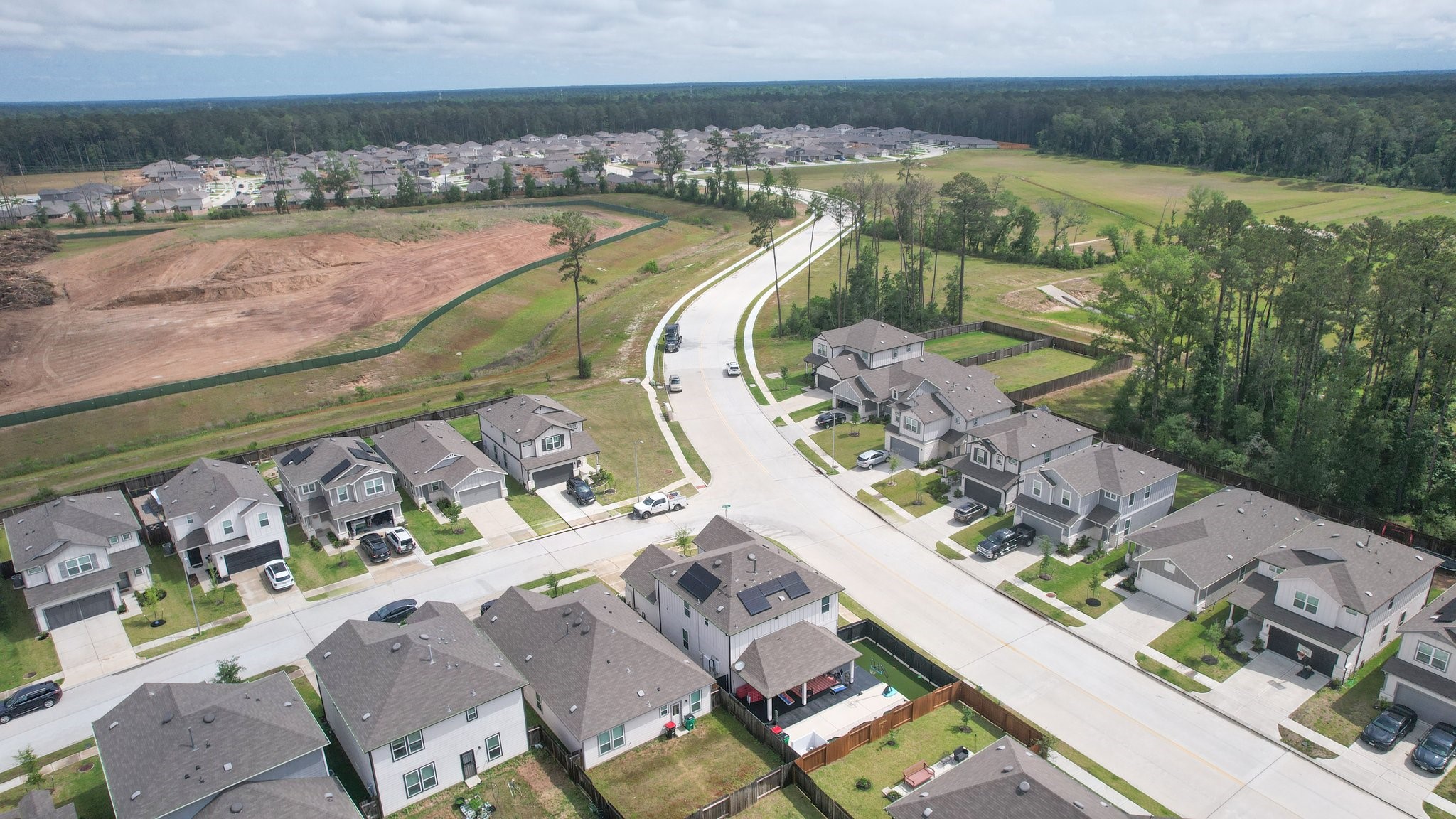 5834 Finely Run St Spring Spring, TX 77373 - Photo 42 of 50 an aerial view of a house with a lake