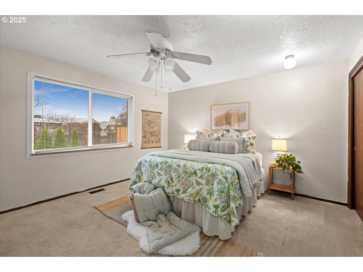 253 South Tarrybrook Circle Cornelius, OR 97113 - Photo 16 of 23 a bedroom with a bed and a chandelier