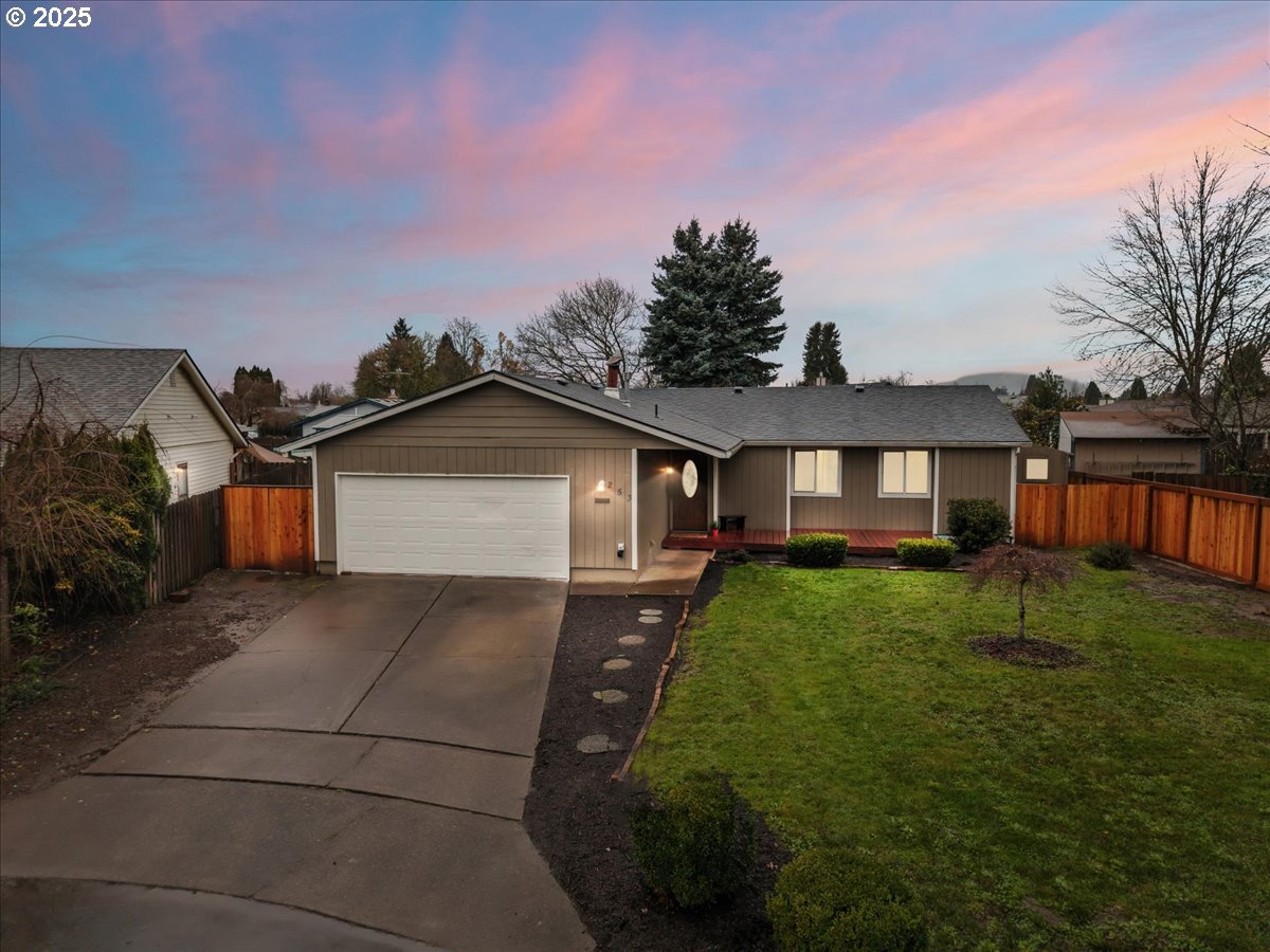 253 South Tarrybrook Circle Cornelius, OR 97113 - Photo 2 of 23 a view of a house with a yard and garage