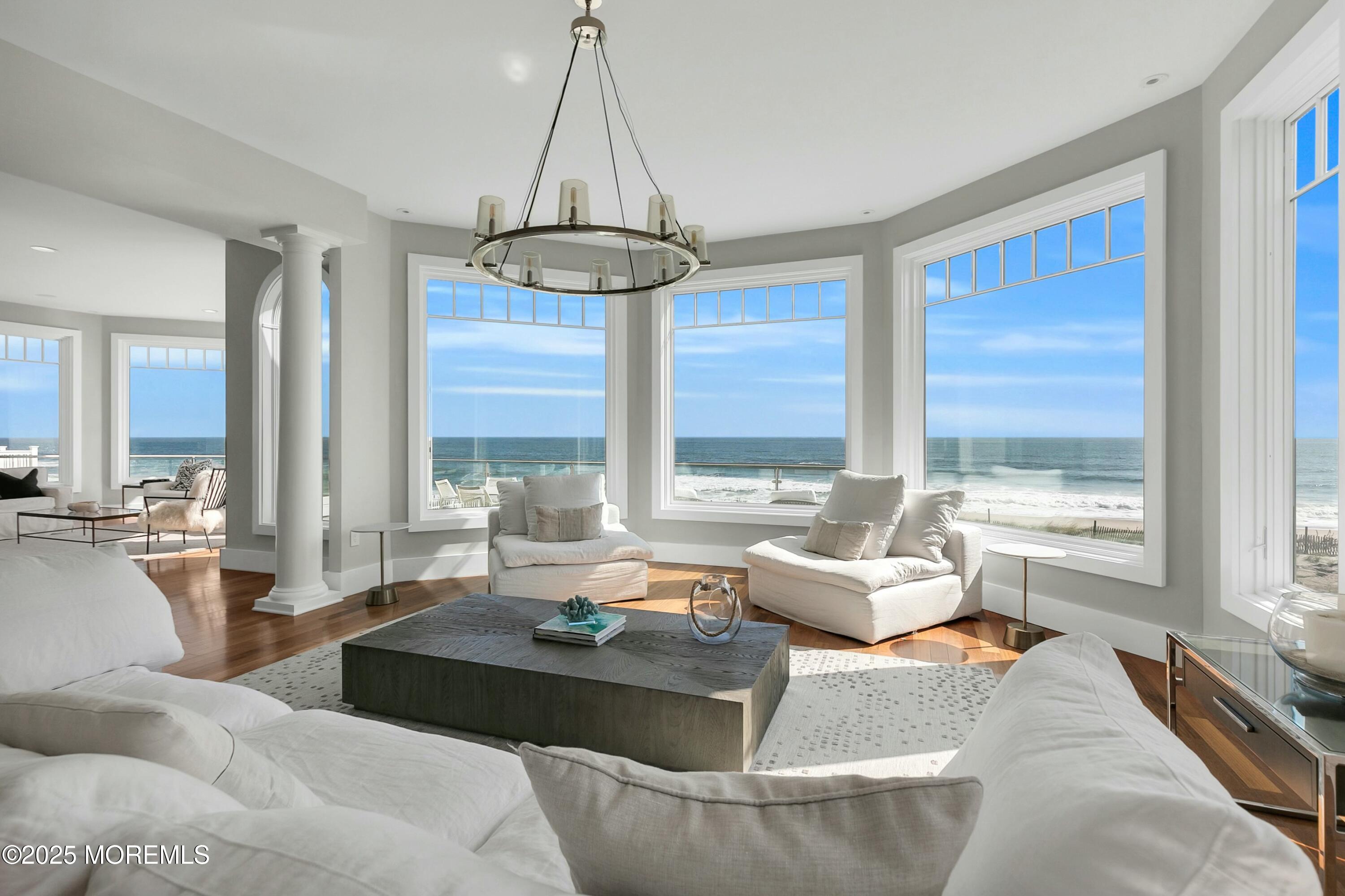 15 Tradewinds Lane Sea Bright, NJ 07760 - Photo 1 of 43 a living room with furniture and a chandelier
