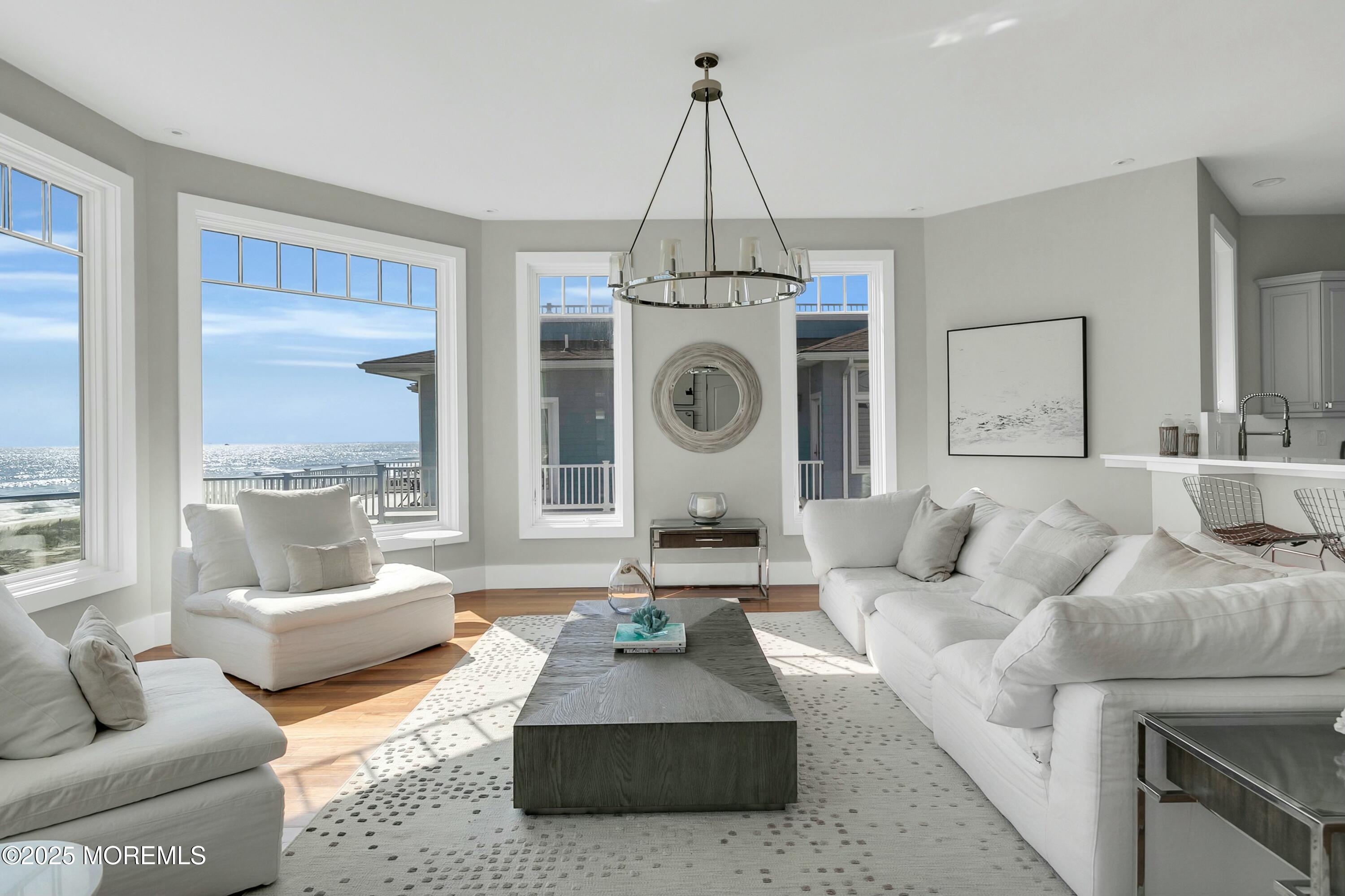 15 Tradewinds Lane Sea Bright, NJ 07760 - Photo 11 of 43 a living room with furniture and a large window