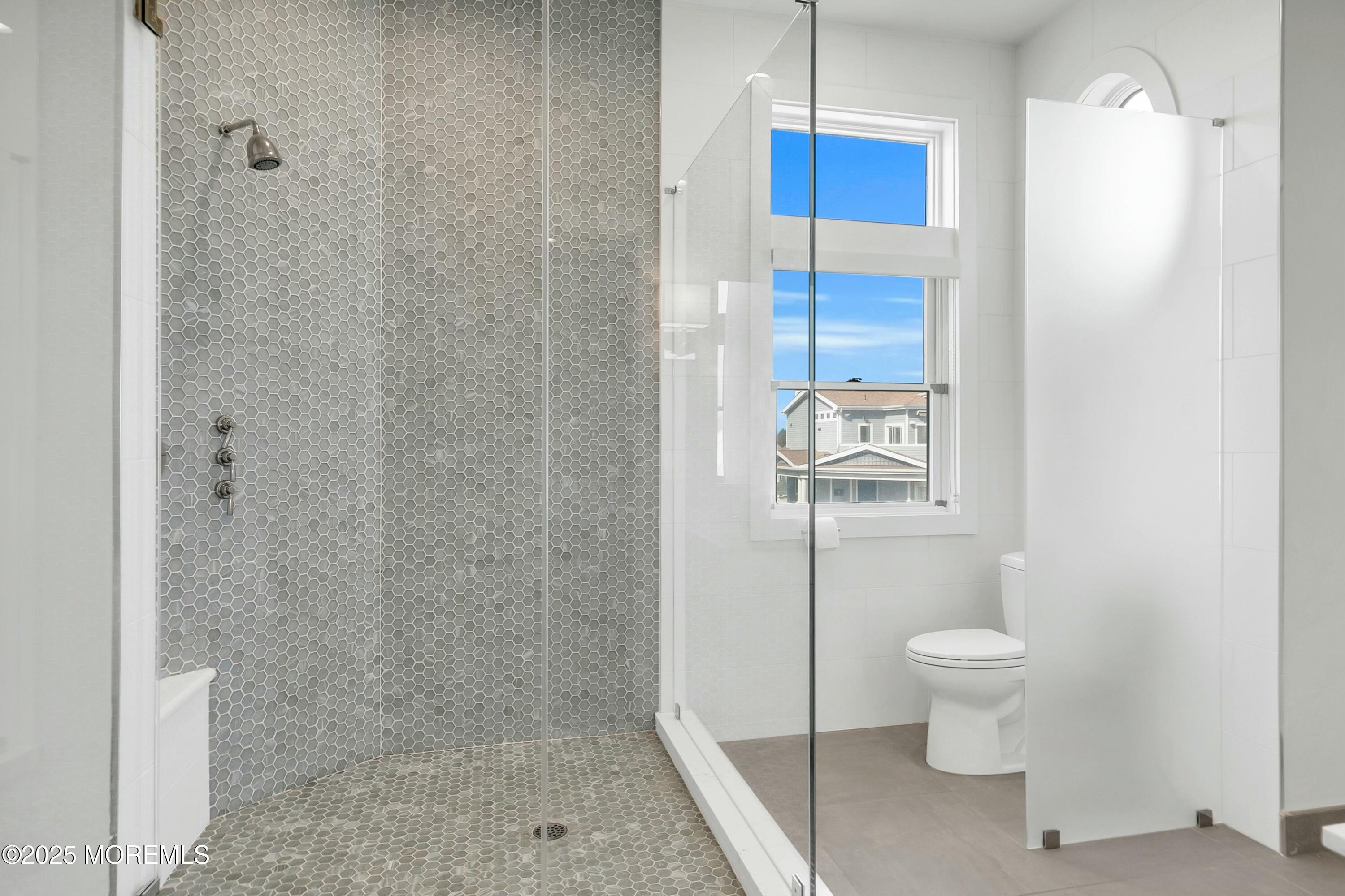 15 Tradewinds Lane Sea Bright, NJ 07760 - Photo 19 of 43 a bathroom with a toilet and a shower