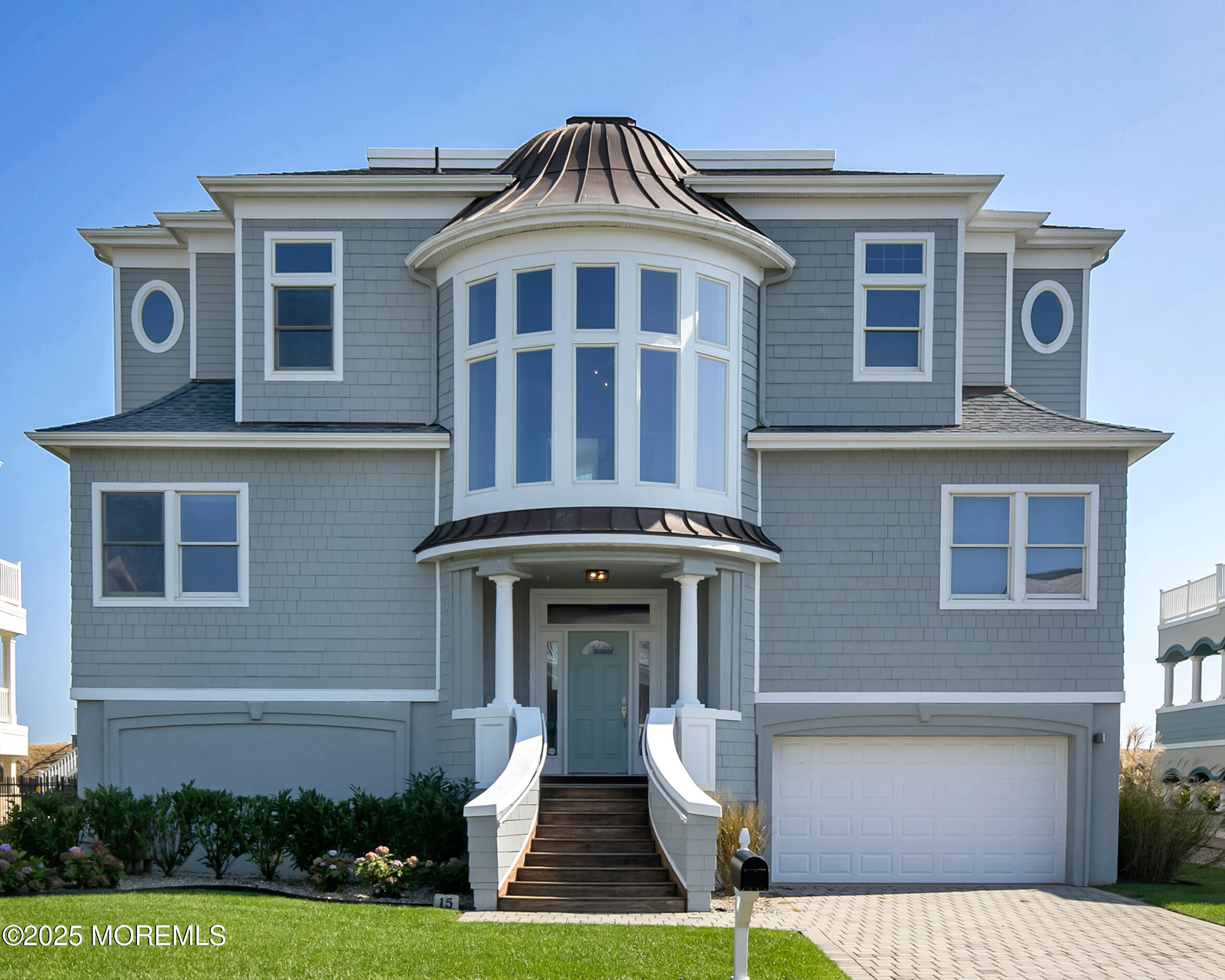 15 Tradewinds Lane Sea Bright, NJ 07760 - Photo 2 of 43 a front view of a house with garden