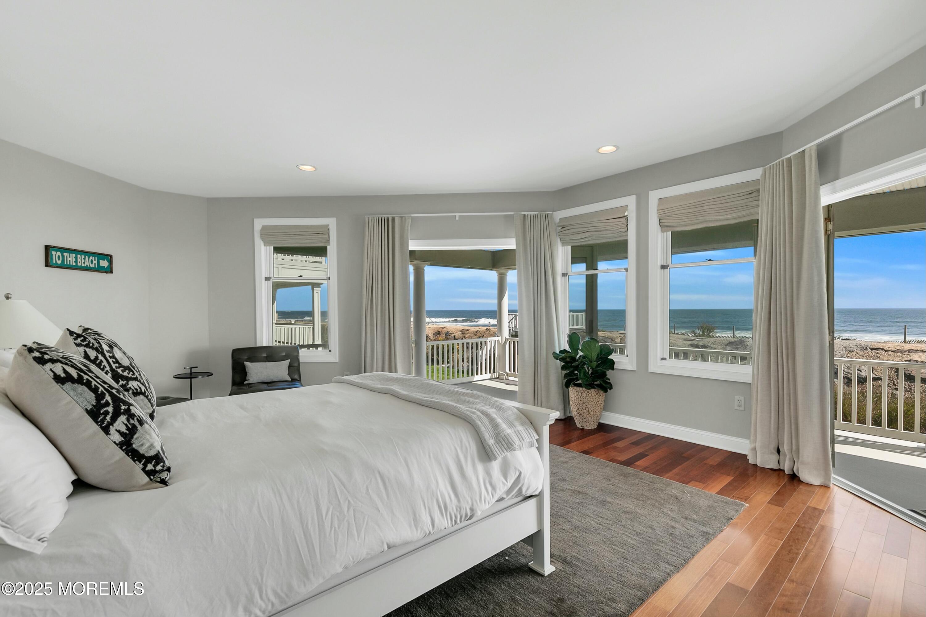 15 Tradewinds Lane Sea Bright, NJ 07760 - Photo 23 of 43 a bedroom with a large bed and windows