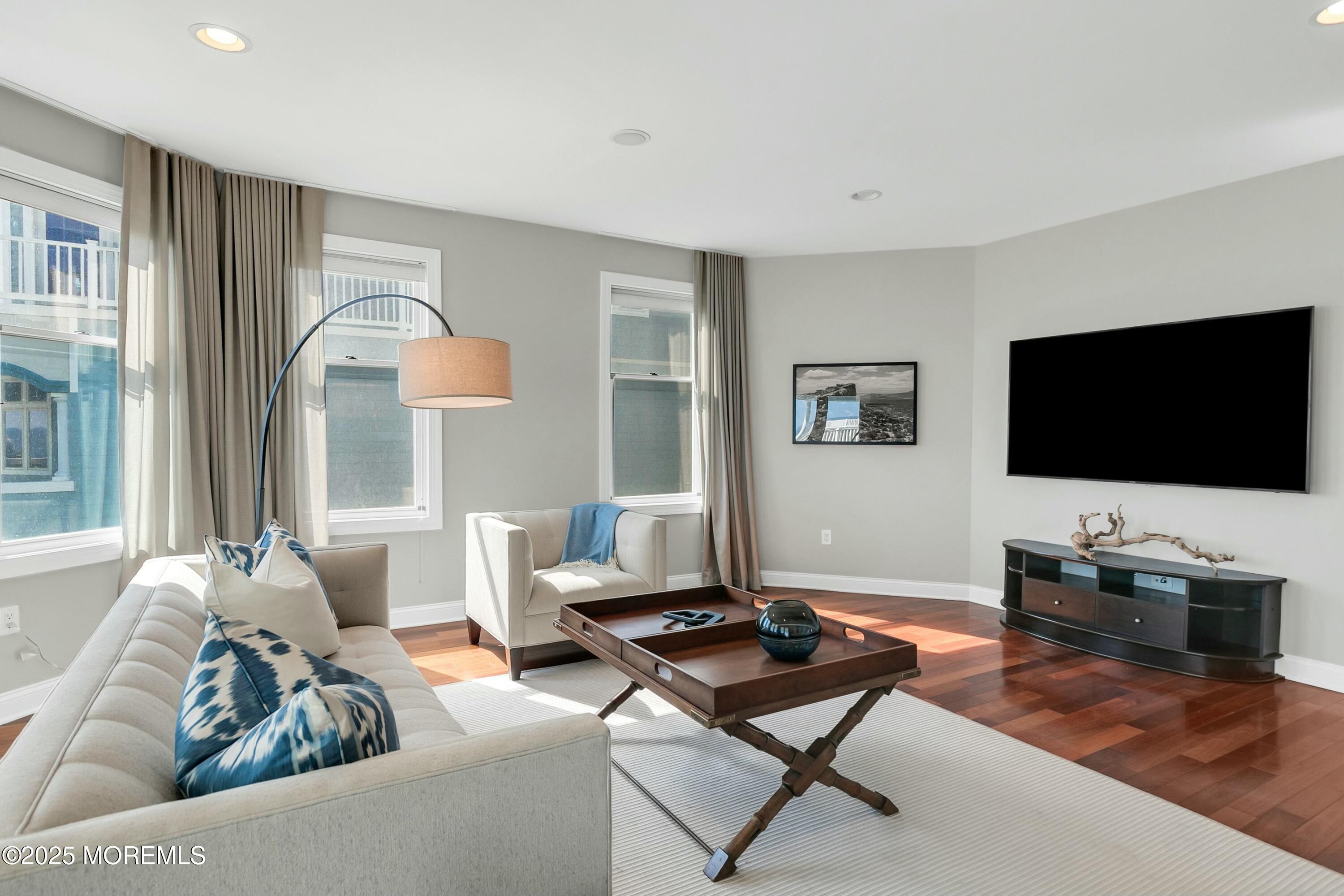15 Tradewinds Lane Sea Bright, NJ 07760 - Photo 27 of 43 a living room with furniture and a flat screen tv