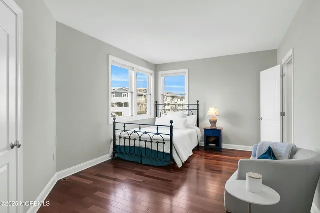 a bathroom with a sink toilet and a mirror