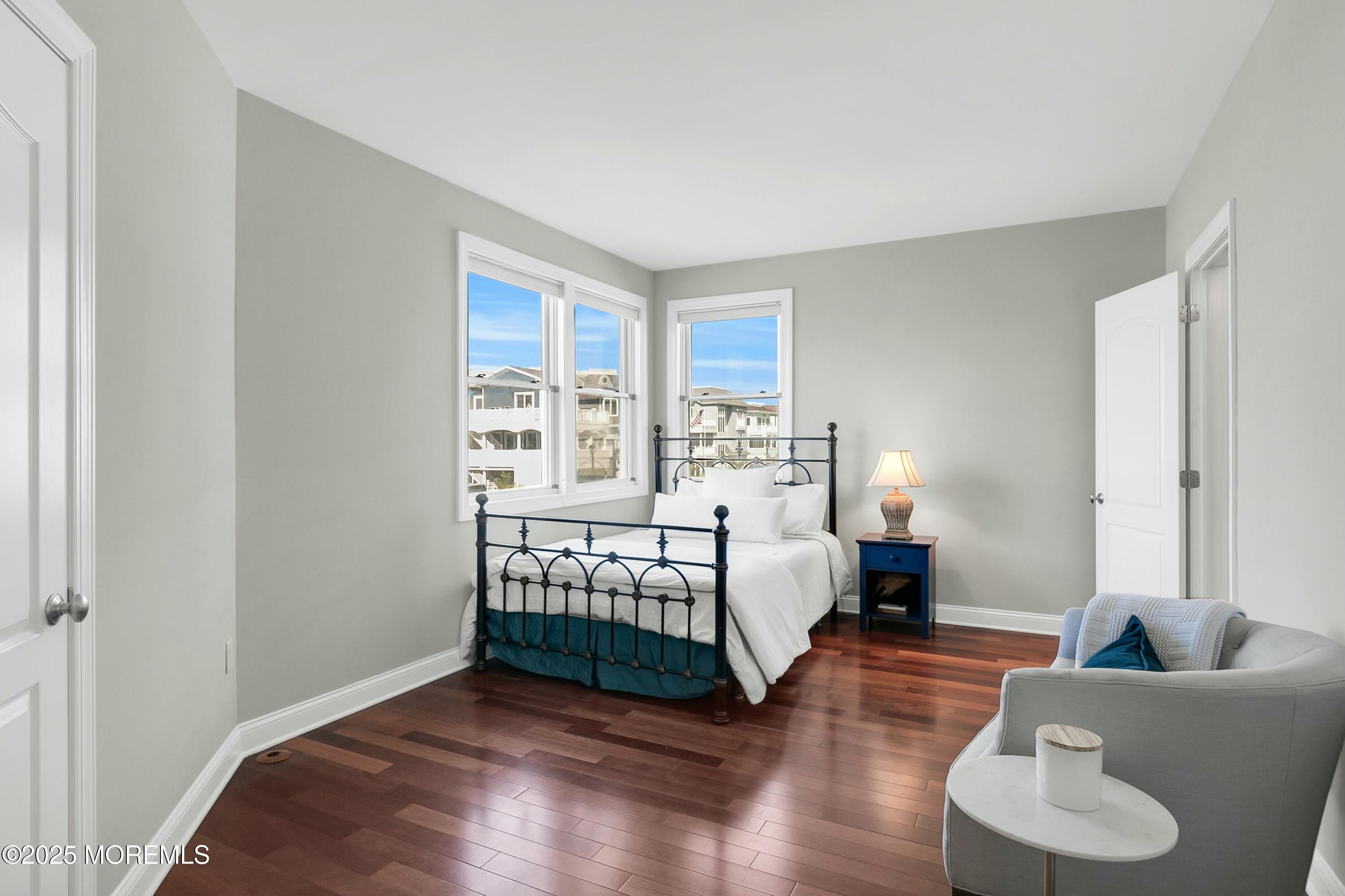 15 Tradewinds Lane Sea Bright, NJ 07760 - Photo 31 of 43 a bedroom with a bed and wooden floor