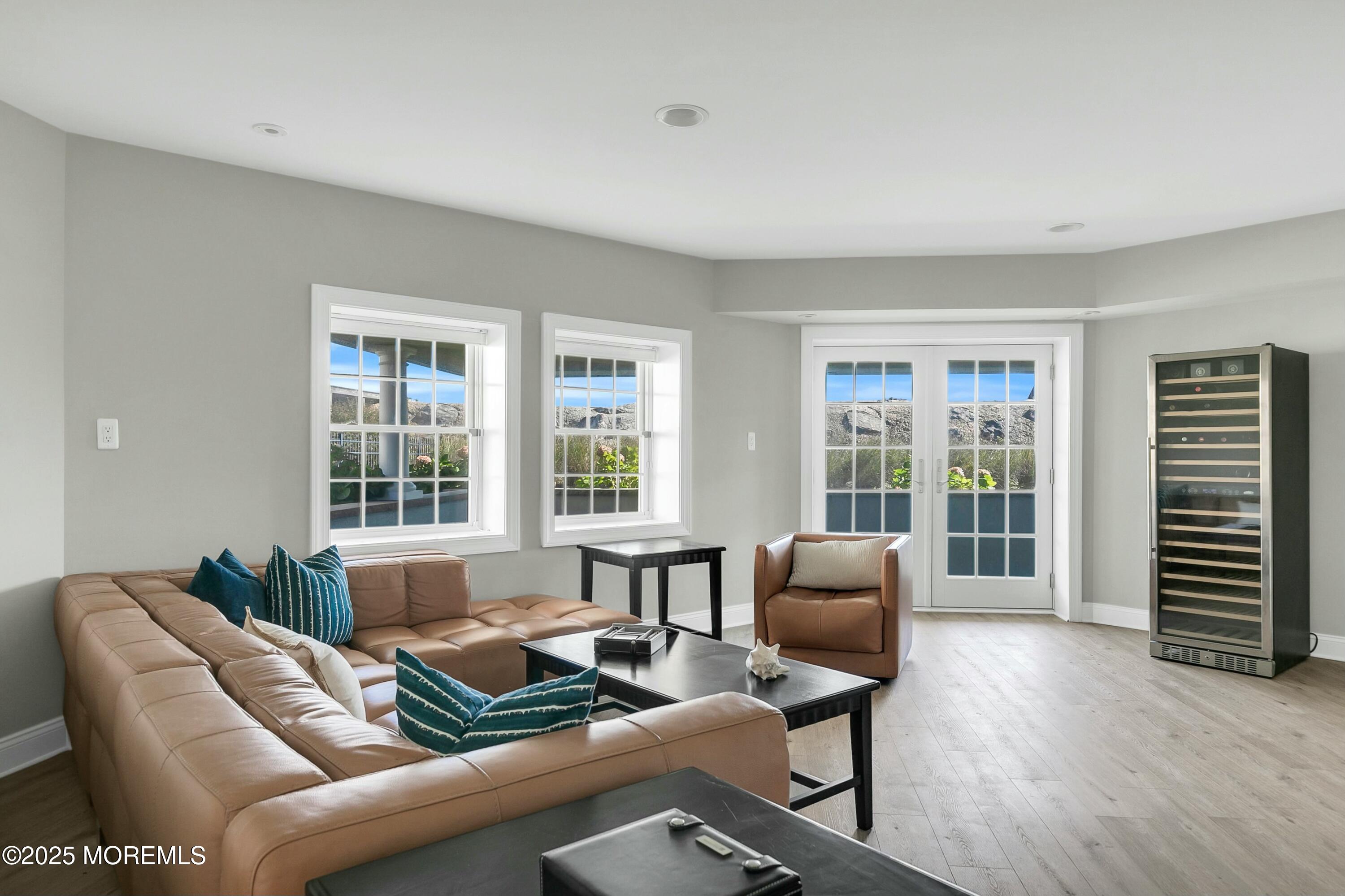 15 Tradewinds Lane Sea Bright, NJ 07760 - Photo 35 of 43 a living room with furniture and floor to ceiling windows
