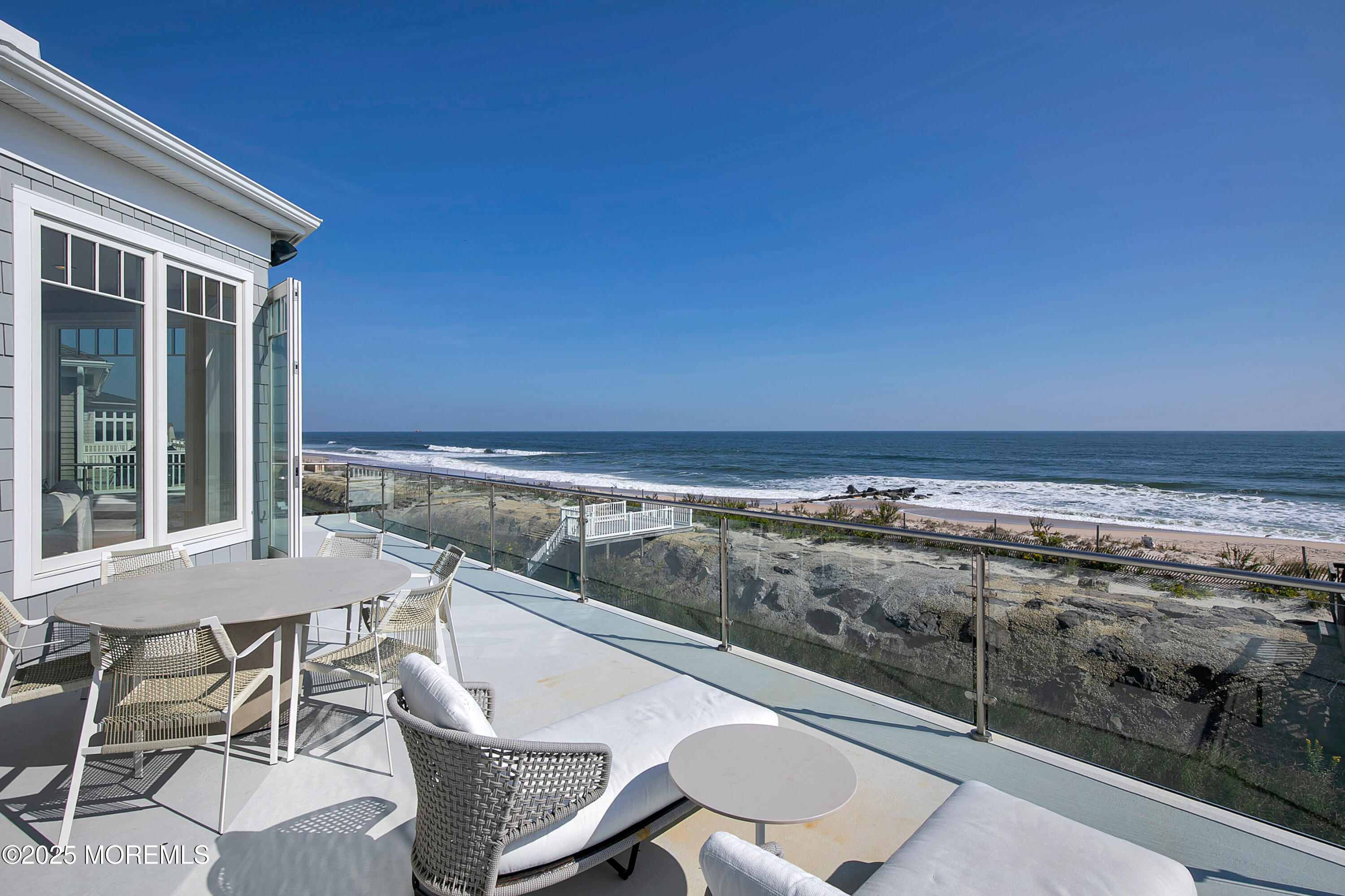 15 Tradewinds Lane Sea Bright, NJ 07760 - Photo 4 of 43 a view of a balcony with chair and table