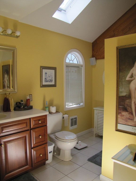 167 Mendon Road Sutton, MA 01590 - Photo 11 of 27 a bathroom with a toilet sink and mirror
