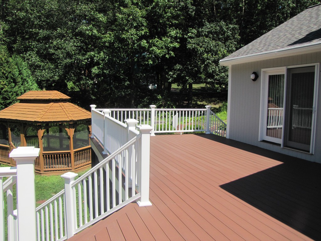 167 Mendon Road Sutton, MA 01590 - Photo 24 of 27 a view of a wooden deck with a yard