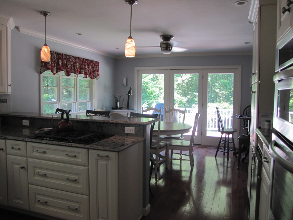 167 Mendon Road Sutton, MA 01590 - Photo 5 of 27 a kitchen with granite countertop a stove a sink and a granite counter top