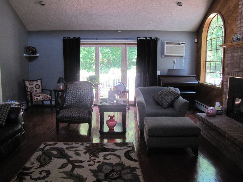 167 Mendon Road Sutton, MA 01590 - Photo 7 of 27 a living room with furniture and a large window