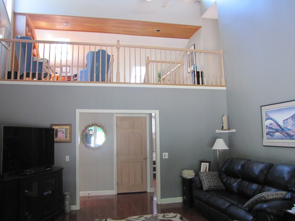 167 Mendon Road Sutton, MA 01590 - Photo 8 of 27 a living room with furniture a flat screen tv and a window