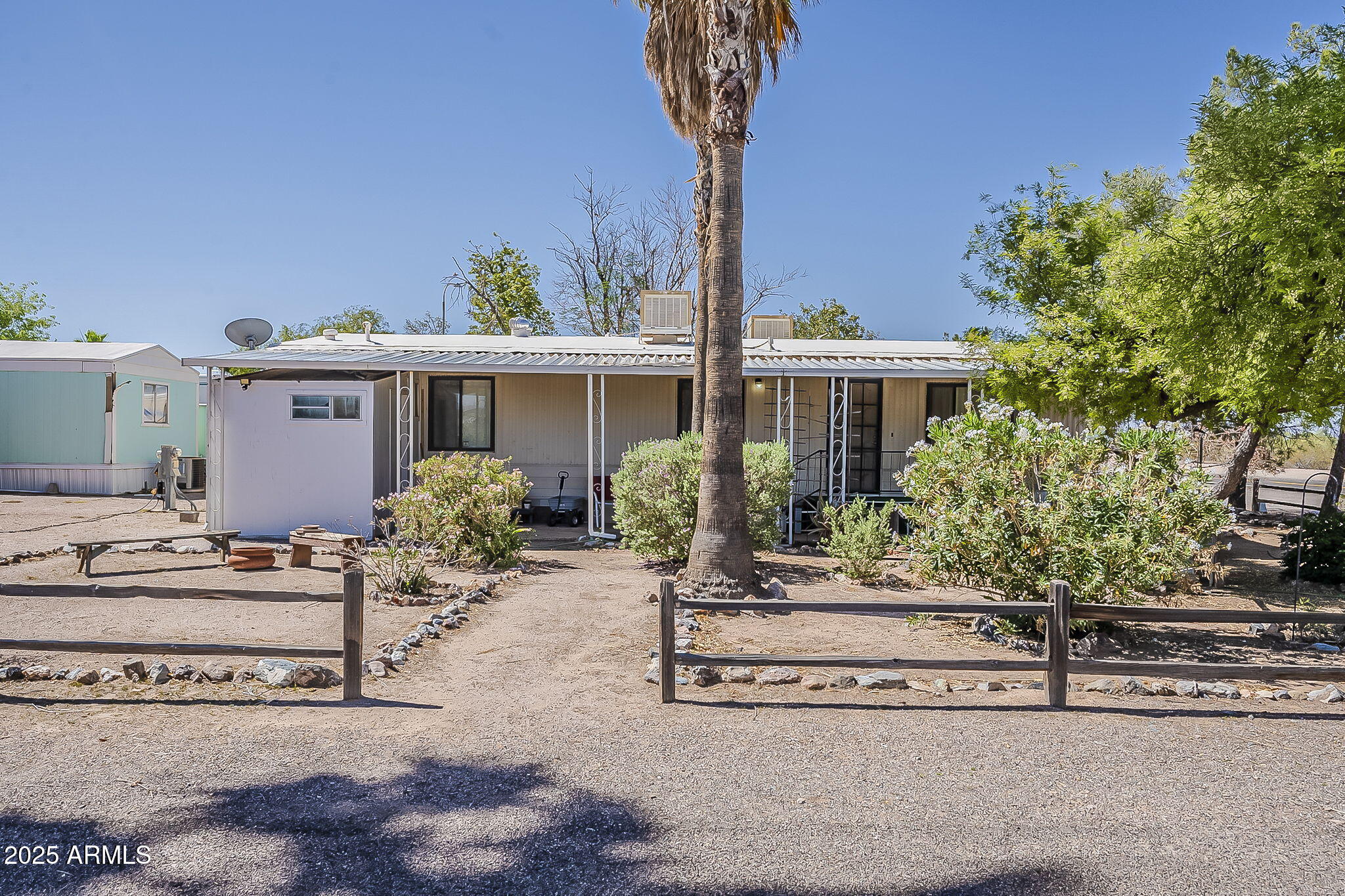 1617 South Cortez Road, Unit 1 Apache Junction, AZ 85119 - Photo 1 of 33 a front view of a house with garden