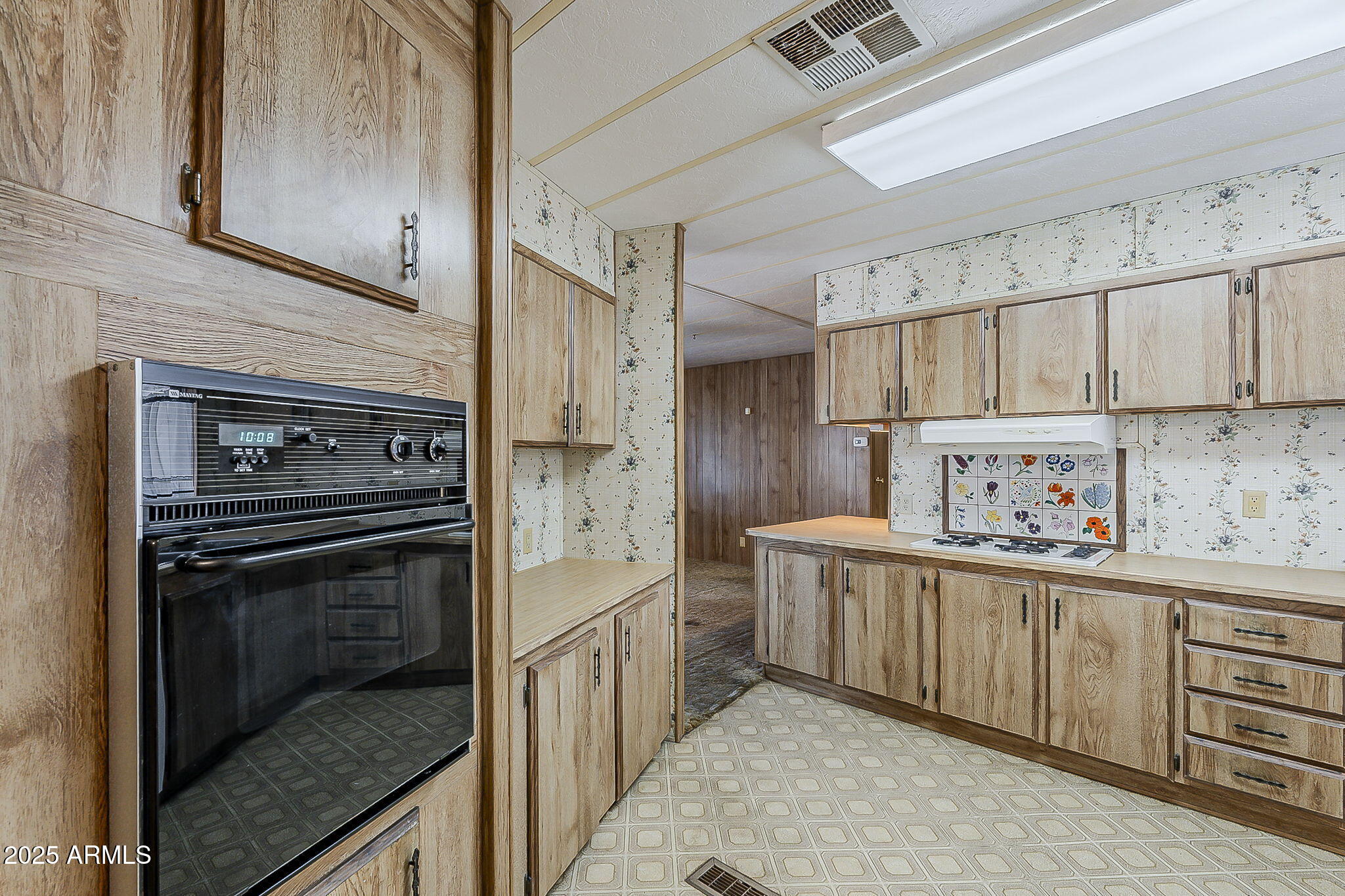 1617 South Cortez Road, Unit 1 Apache Junction, AZ 85119 - Photo 13 of 33 a kitchen with stainless steel appliances a stove sink and cabinets