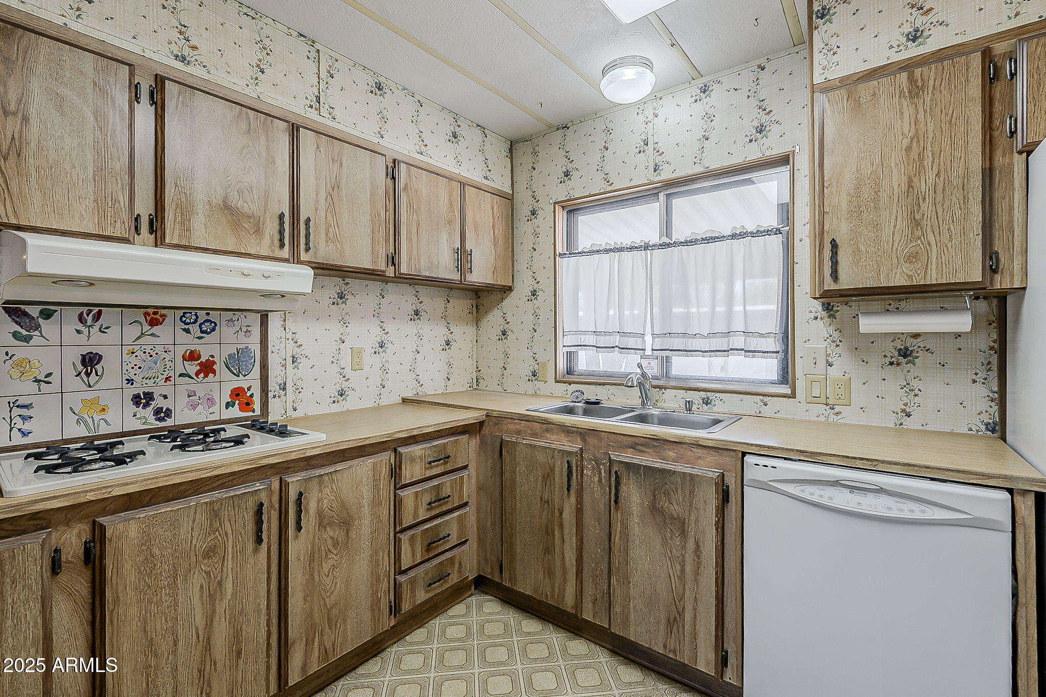 1617 South Cortez Road, Unit 1 Apache Junction, AZ 85119 - Photo 16 of 33 a kitchen with stainless steel appliances a sink stove and cabinets