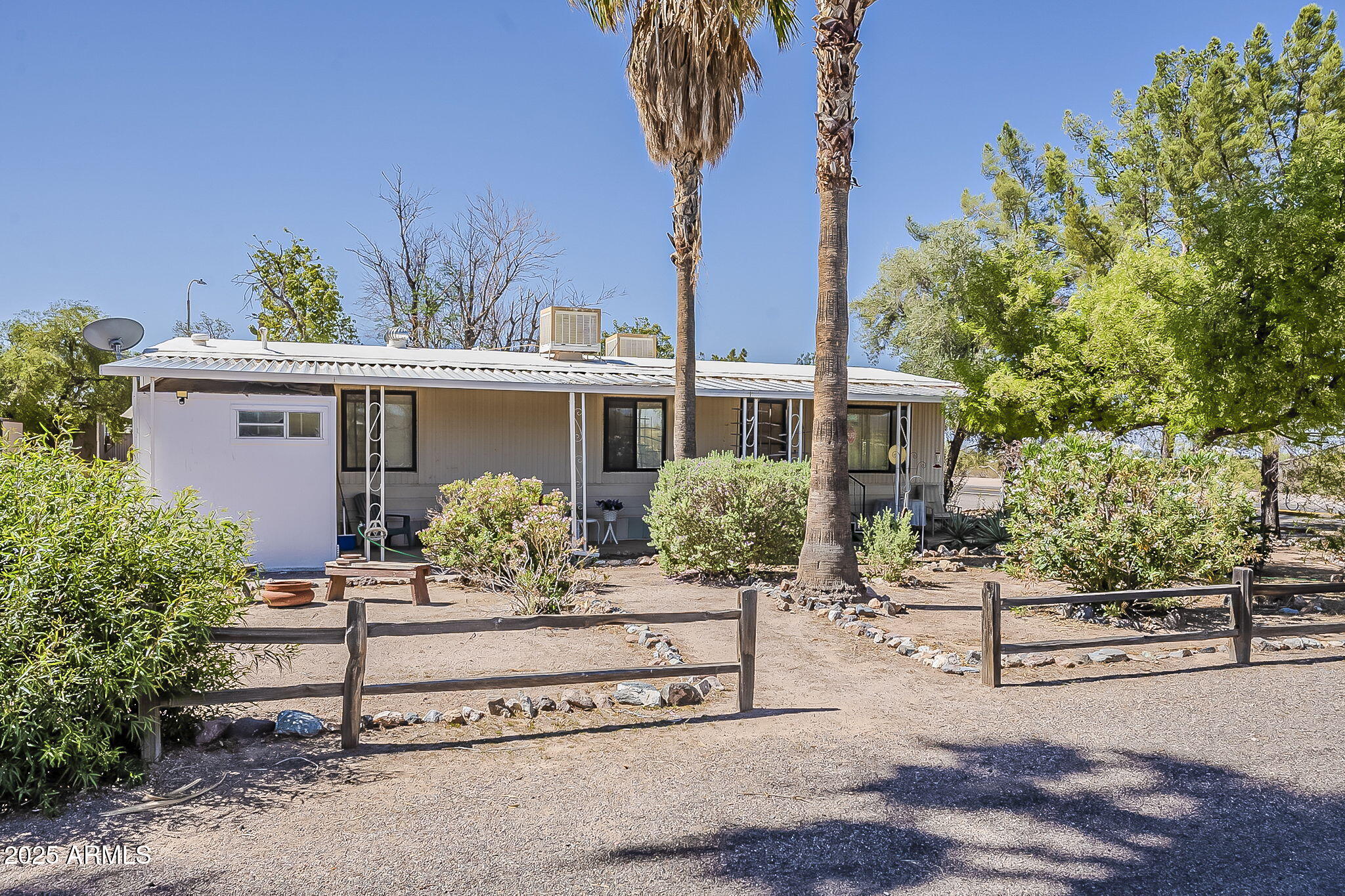 1617 South Cortez Road, Unit 1 Apache Junction, AZ 85119 - Photo 2 of 33 a front view of a house with garden