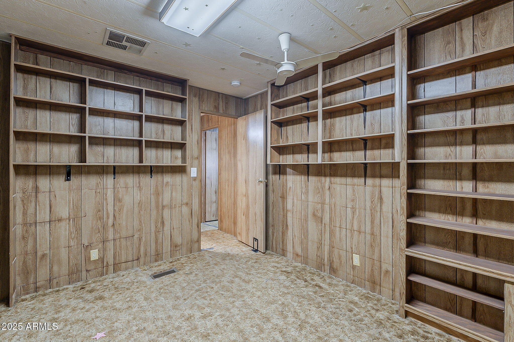1617 South Cortez Road, Unit 1 Apache Junction, AZ 85119 - Photo 23 of 33 a view of walk in closet with empty racks
