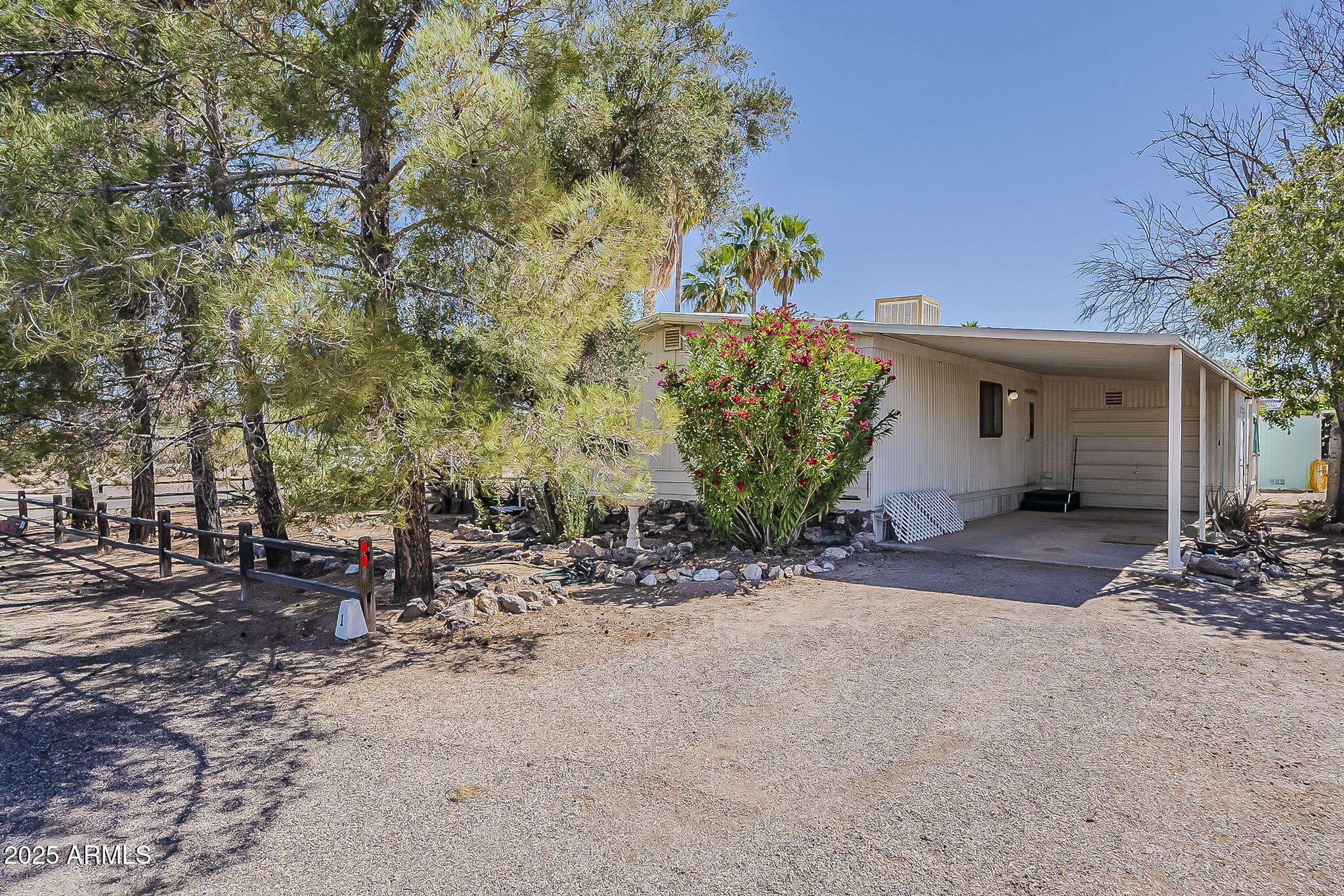 1617 South Cortez Road, Unit 1 Apache Junction, AZ 85119 - Photo 32 of 33 a view of a house with a tree and plant