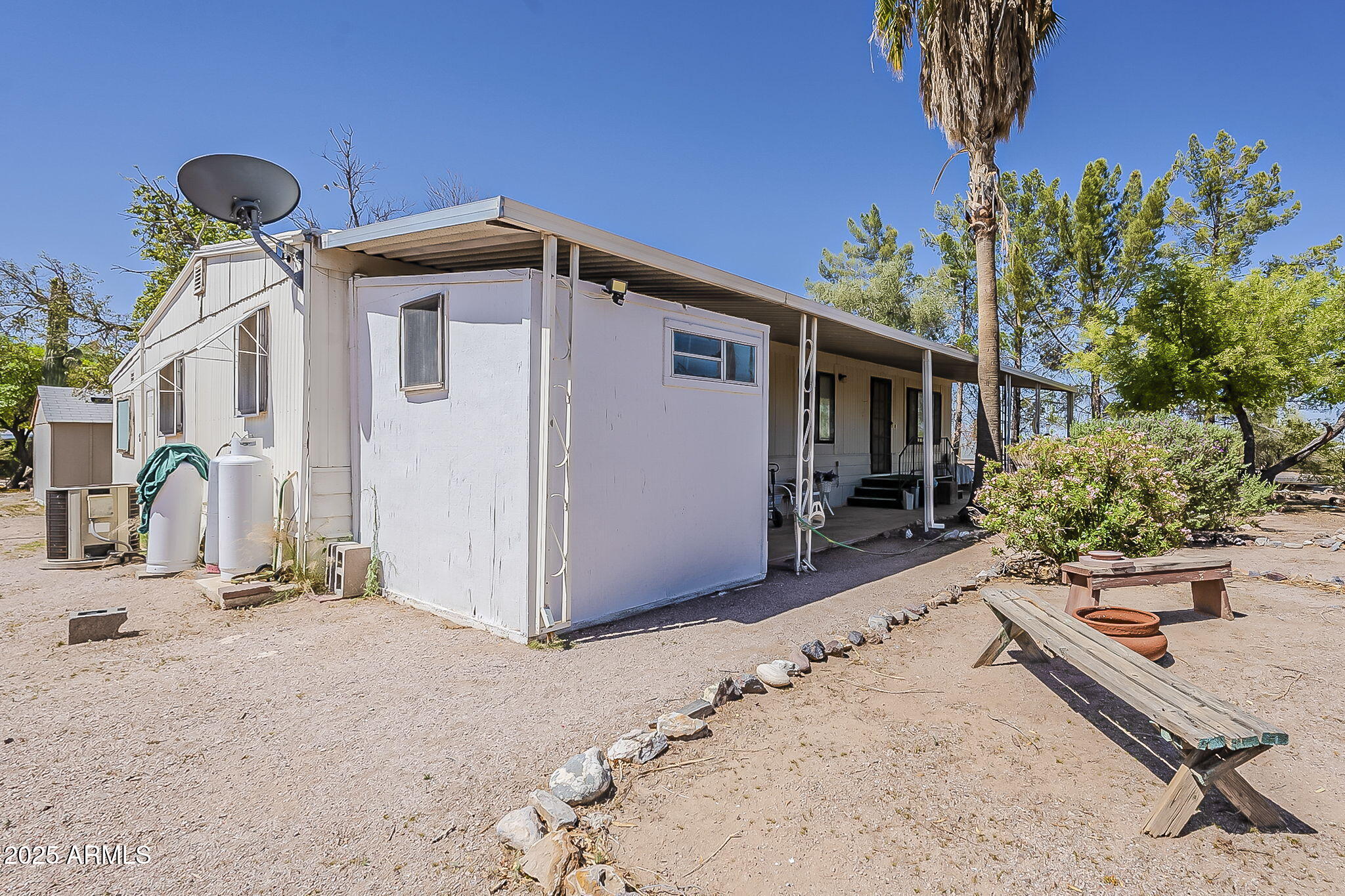 1617 South Cortez Road, Unit 1 Apache Junction, AZ 85119 - Photo 33 of 33 a front view of a house with a yard