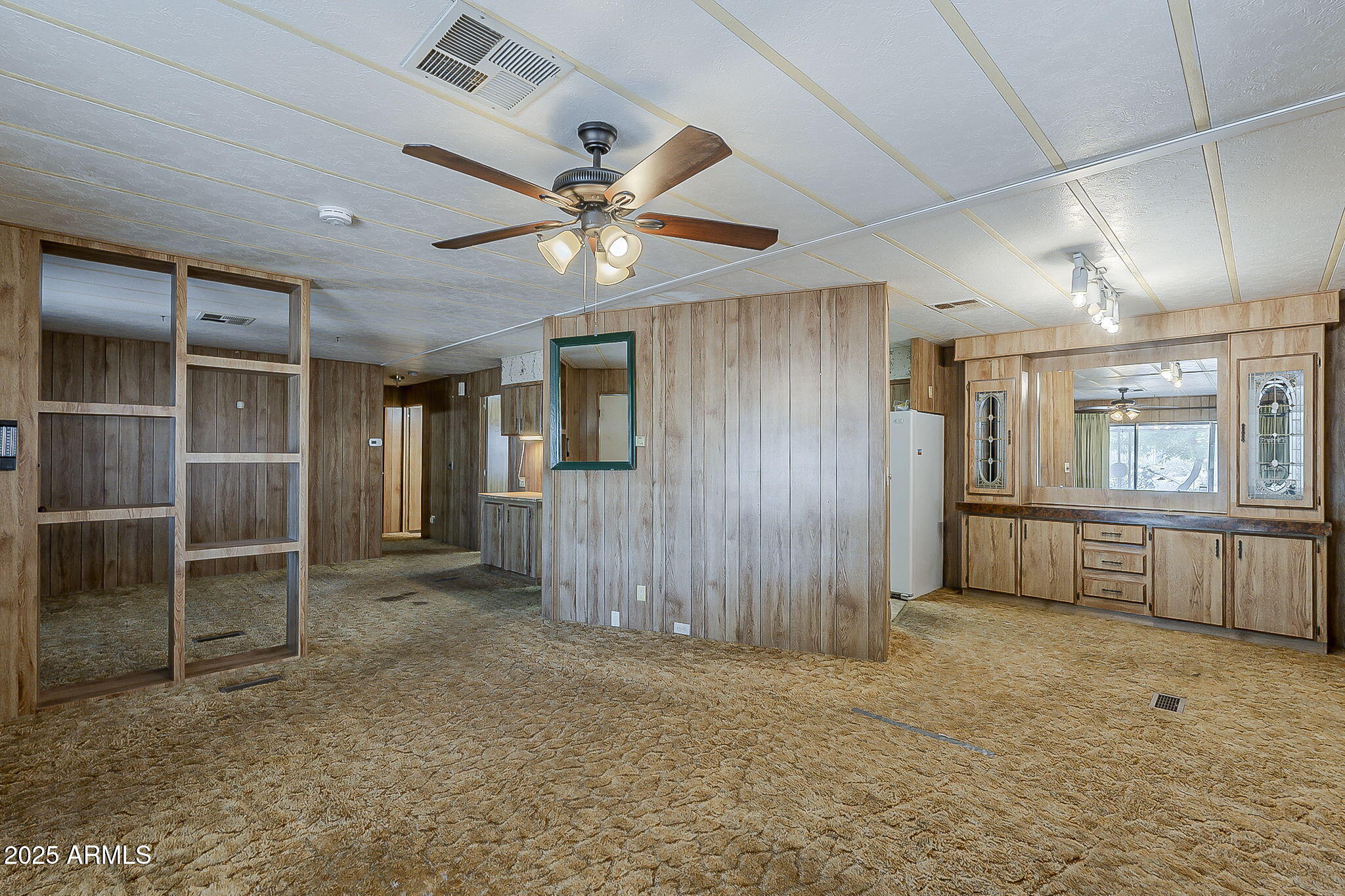 1617 South Cortez Road, Unit 1 Apache Junction, AZ 85119 - Photo 8 of 33 a view of a hallway with entryway and chandelier fan