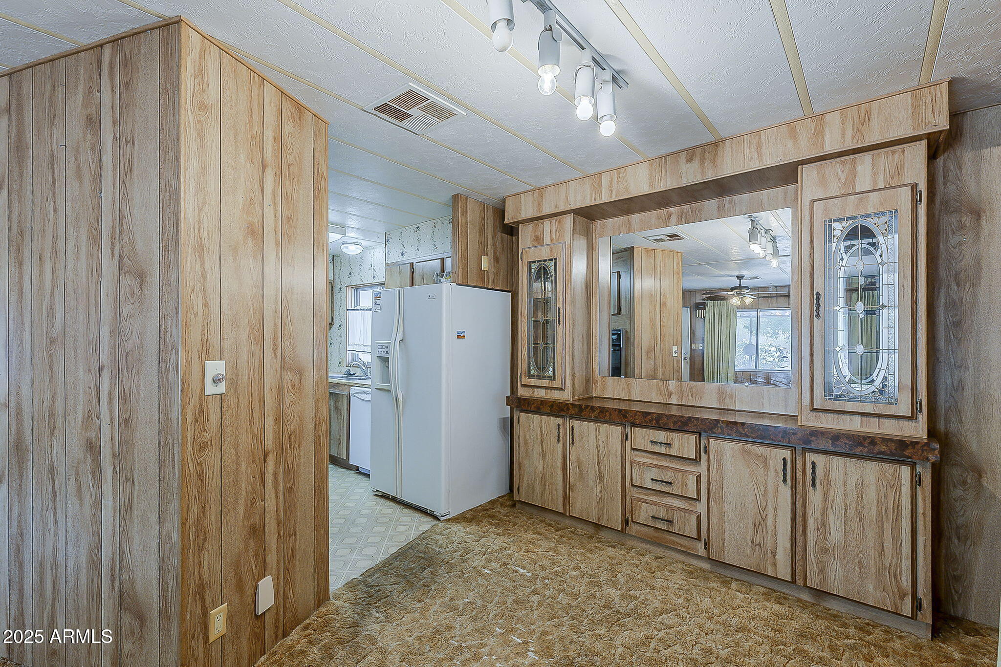 1617 South Cortez Road, Unit 1 Apache Junction, AZ 85119 - Photo 10 of 33 a view of a refrigerator in kitchen and wooden floor