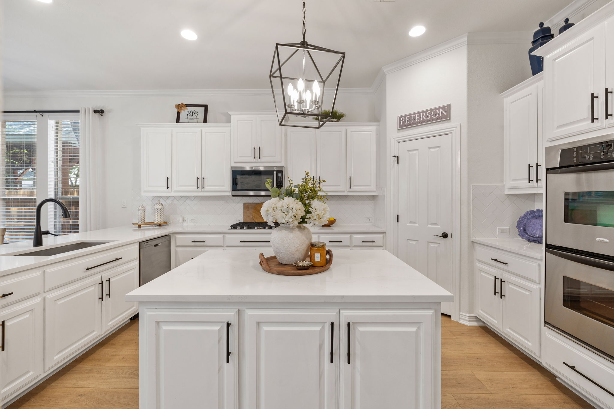 1124 Castle Path Round Rock, TX 78681 - Photo 18 of 40 Bright culinary space featuring an island, sleek appliances, and elegant cabinetry for effortless entertaining.