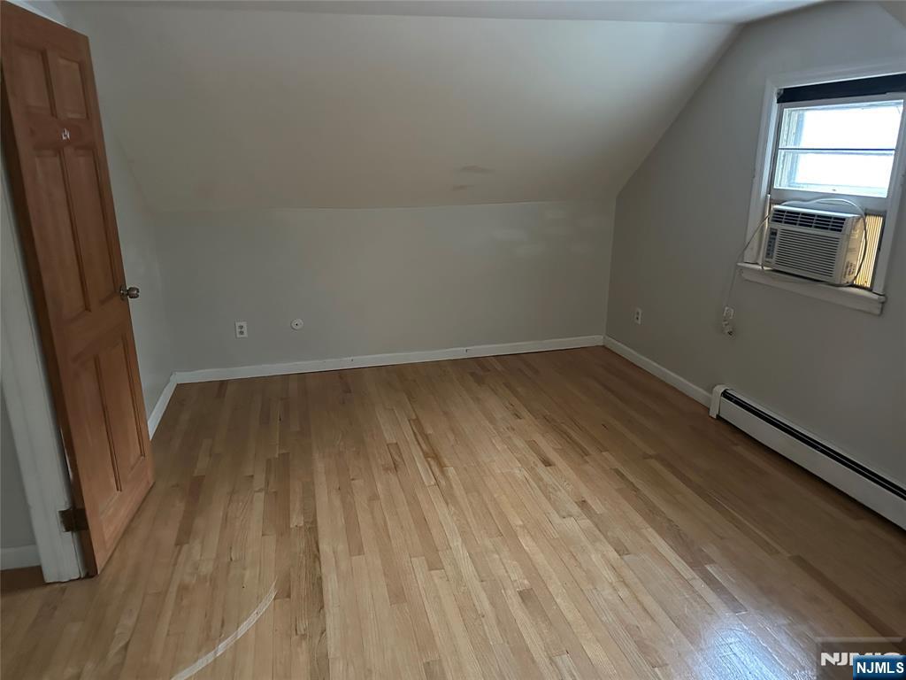 743 Newcomb Road Ridgewood, NJ 07450 - Photo 11 of 16 a view of a room with wooden floor and a window