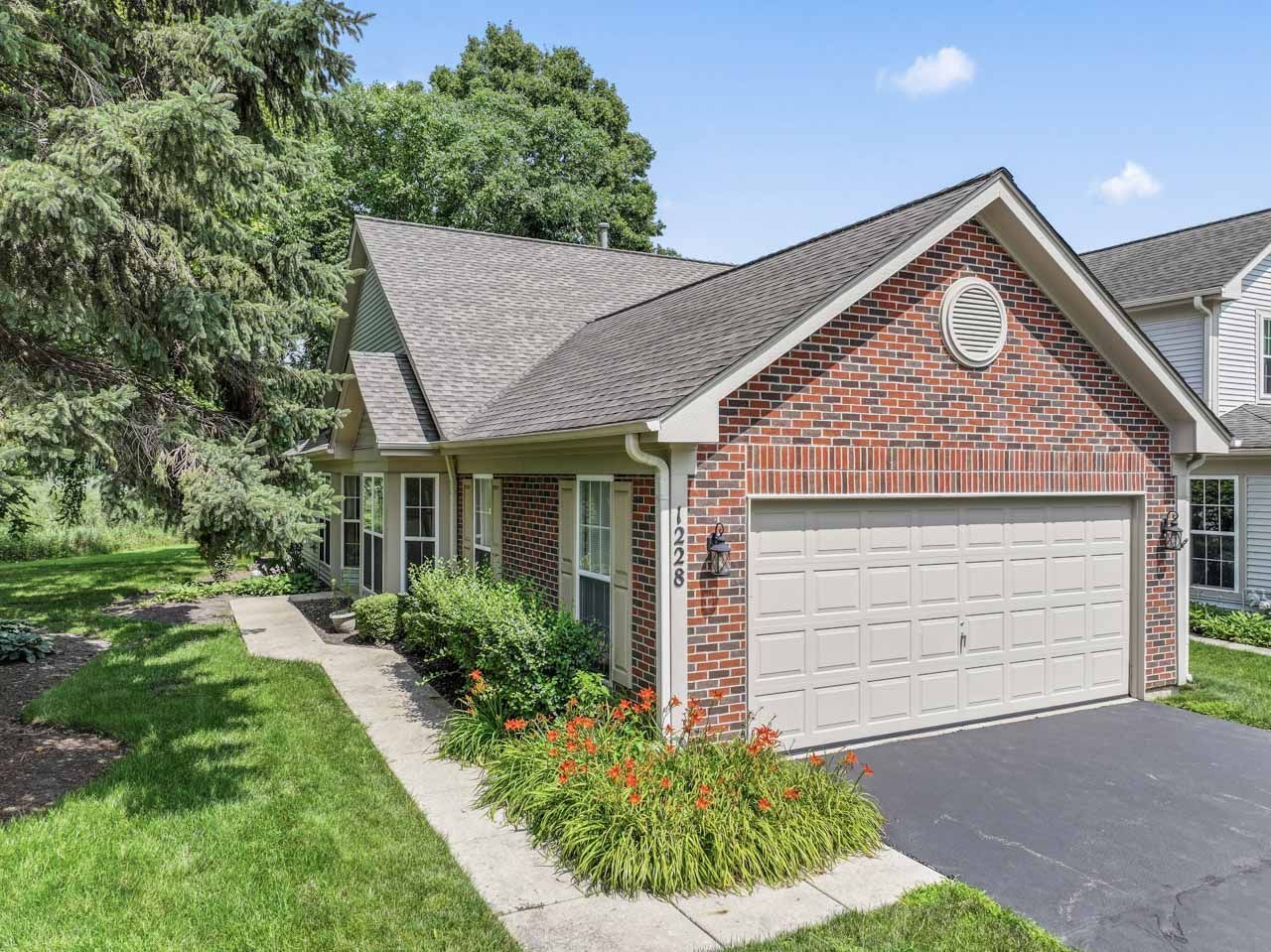 1228 Coldspring Road Elgin, IL 60120 - Photo 1 of 30 a front view of a house with a yard