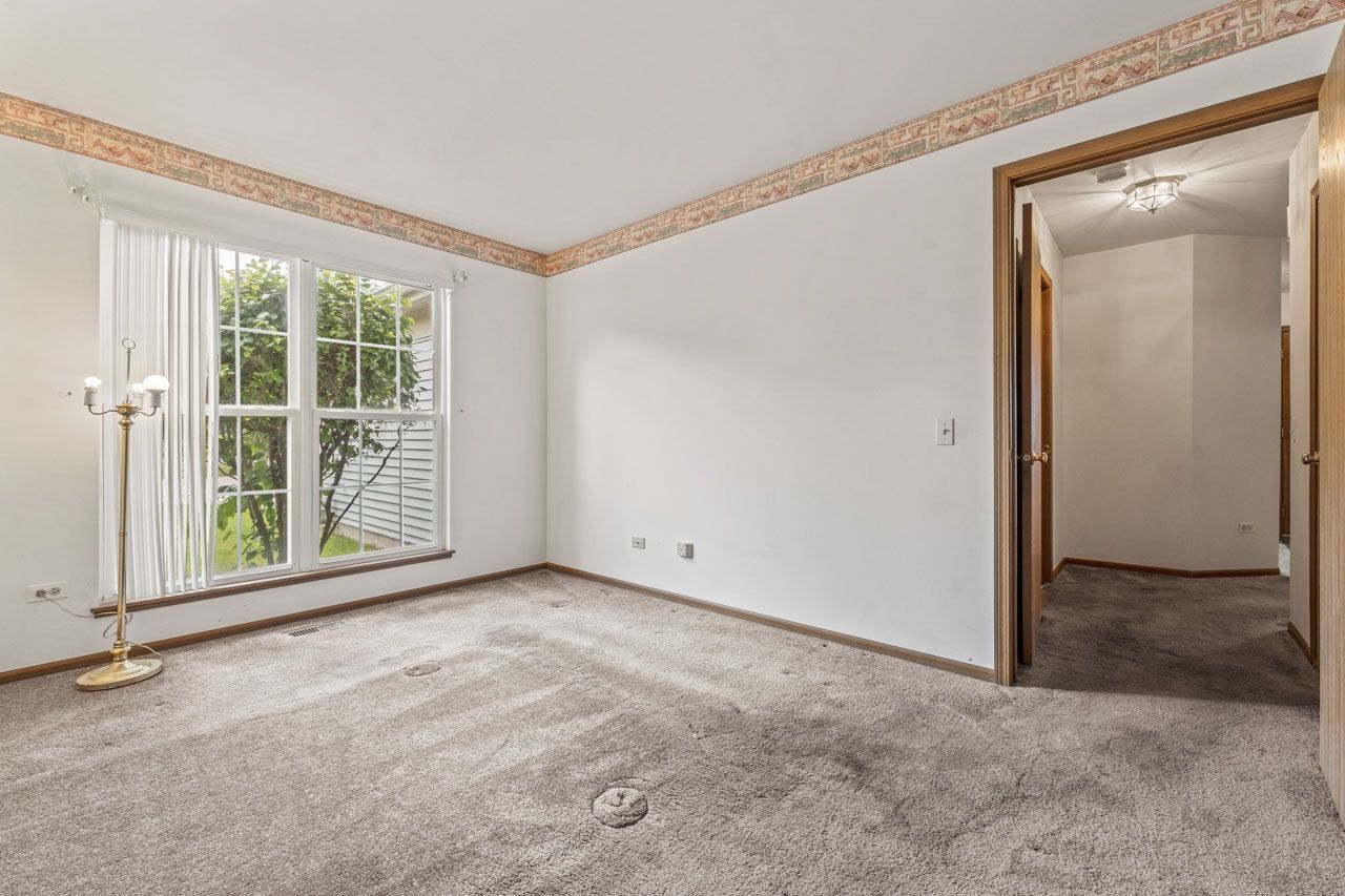 1228 Coldspring Road Elgin, IL 60120 - Photo 23 of 30 an empty room with windows