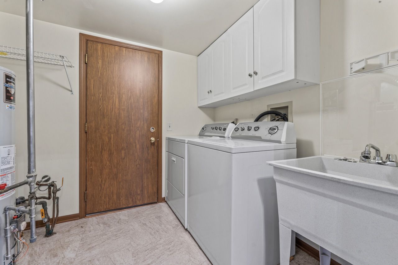 1228 Coldspring Road Elgin, IL 60120 - Photo 26 of 30 a utility room with sink dryer and washer