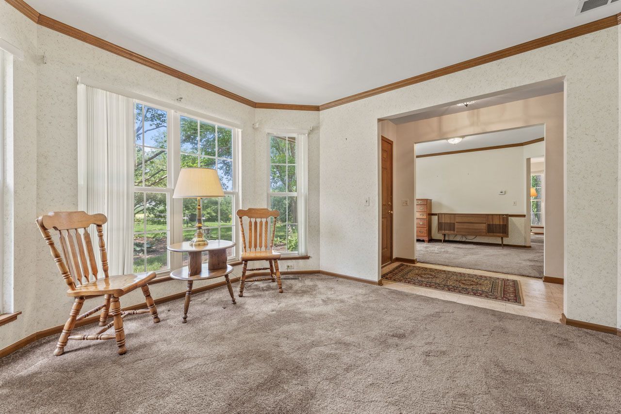 1228 Coldspring Road Elgin, IL 60120 - Photo 6 of 30 a living room with furniture and a floor to ceiling window