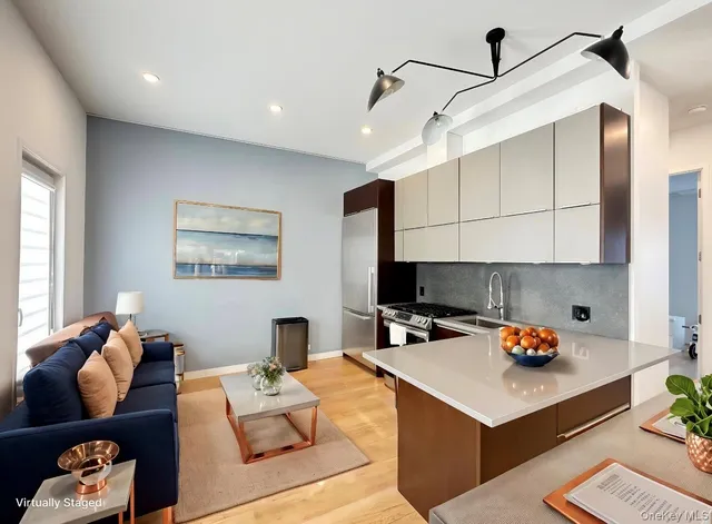 a living room with furniture and white walls