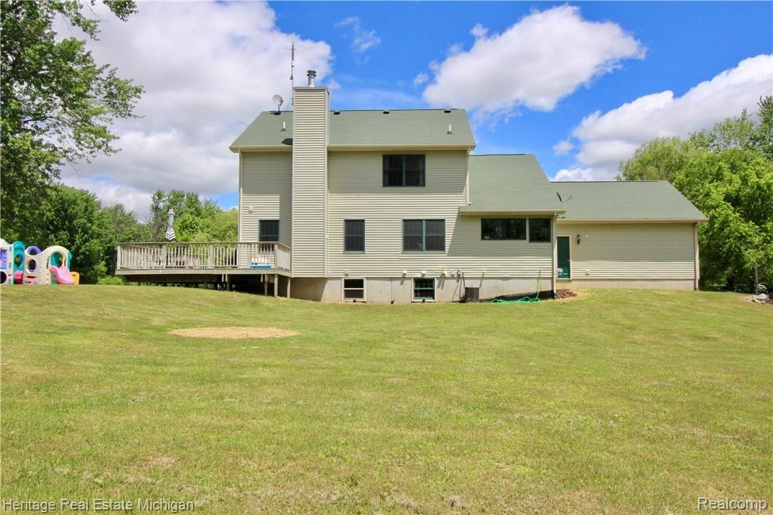 8126 Ruger Ridge Fowlerville, MI 48836 - Photo 48 of 53 Back of home