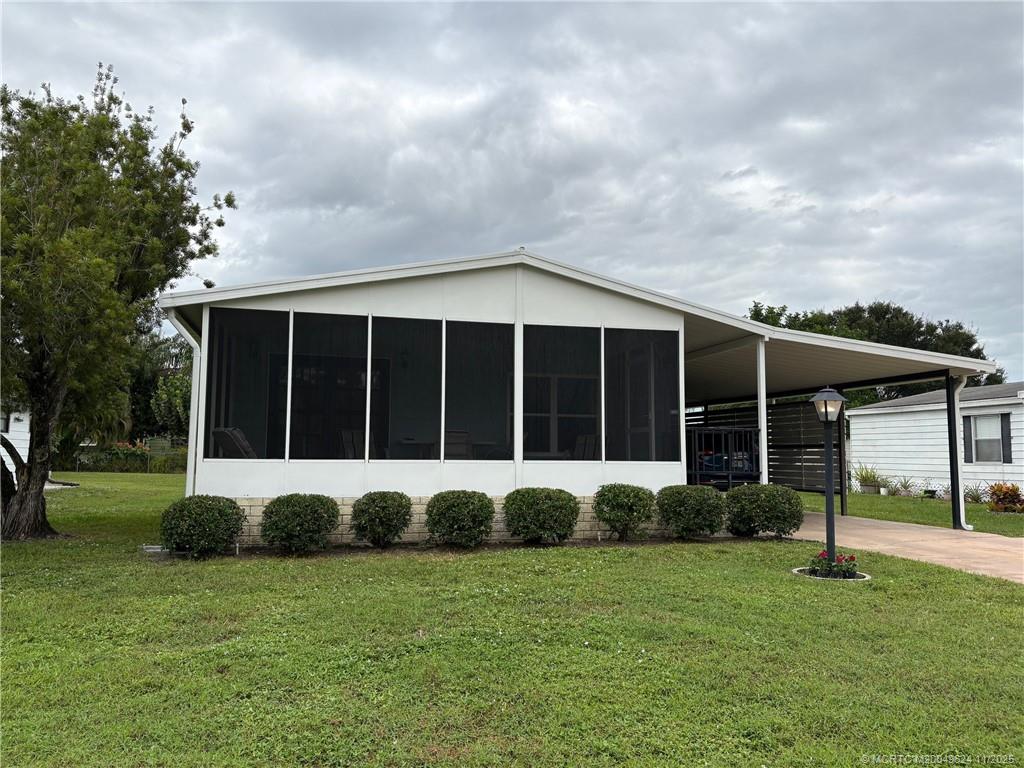 a view of a house with a garden