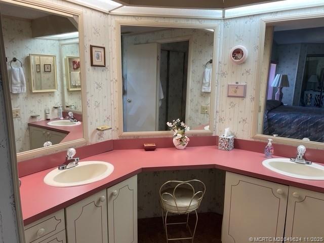 2883 Southwest Monarch Trail Stuart, FL 34997 - Photo 14 of 17 a bathroom with a sink and a mirror