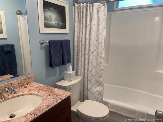2883 Southwest Monarch Trail Stuart, FL 34997 - Photo 16 of 17 a bathroom with a granite countertop sink toilet and shower