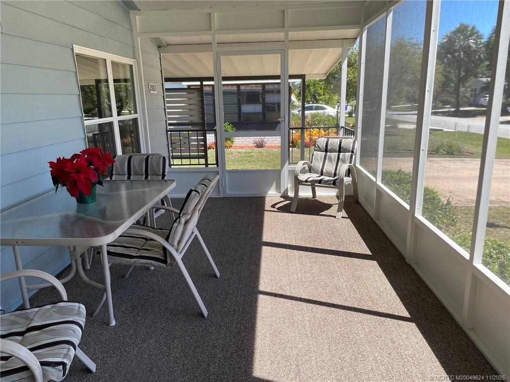 2883 Southwest Monarch Trail Stuart, FL 34997 - Photo 6 of 17 a view of a dining room with furniture window and outside view