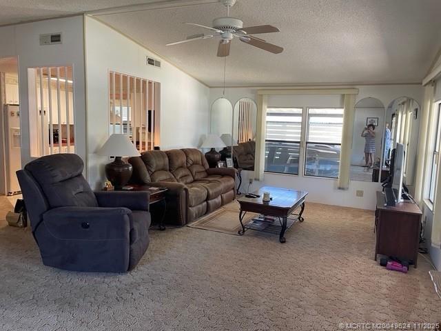 2883 Southwest Monarch Trail Stuart, FL 34997 - Photo 7 of 17 a living room with furniture and a flat screen tv
