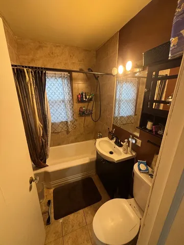 a bedroom with a bed and dresser