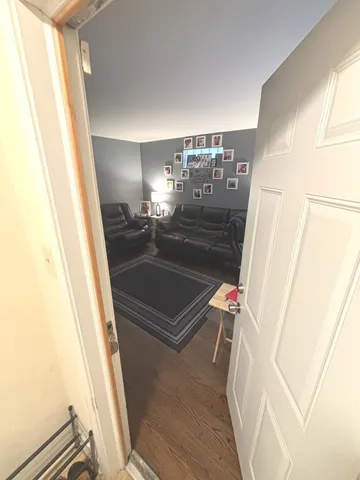 a room with wooden floor and door