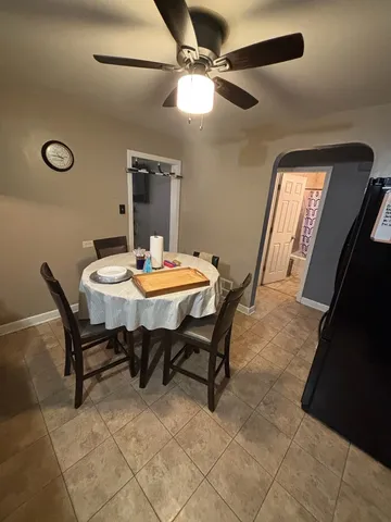 a dining room with furniture and window