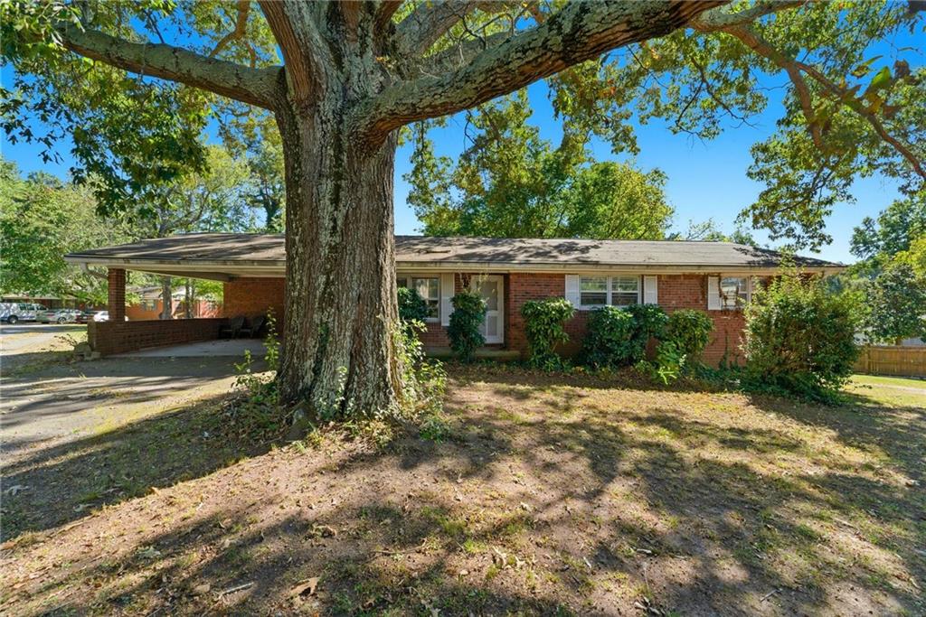 a view of house with yard