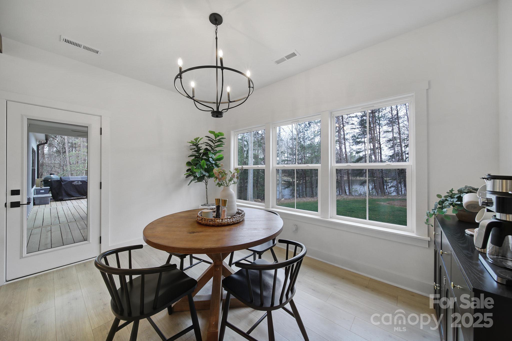 856 Bellegray Road Clover, SC 29710 - Photo 15 of 48 a view of a dining room with furniture window and wooden floor