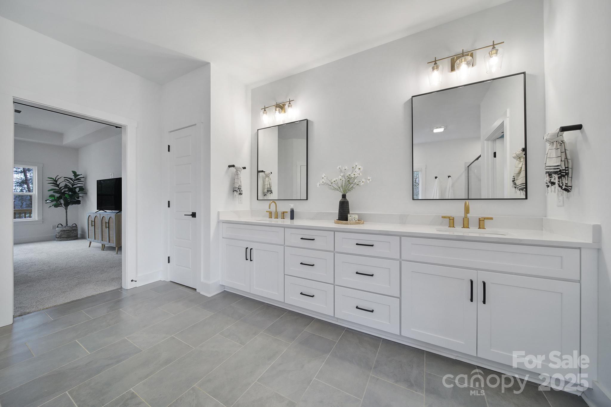 856 Bellegray Road Clover, SC 29710 - Photo 23 of 48 a bathroom with double sink and a mirror
