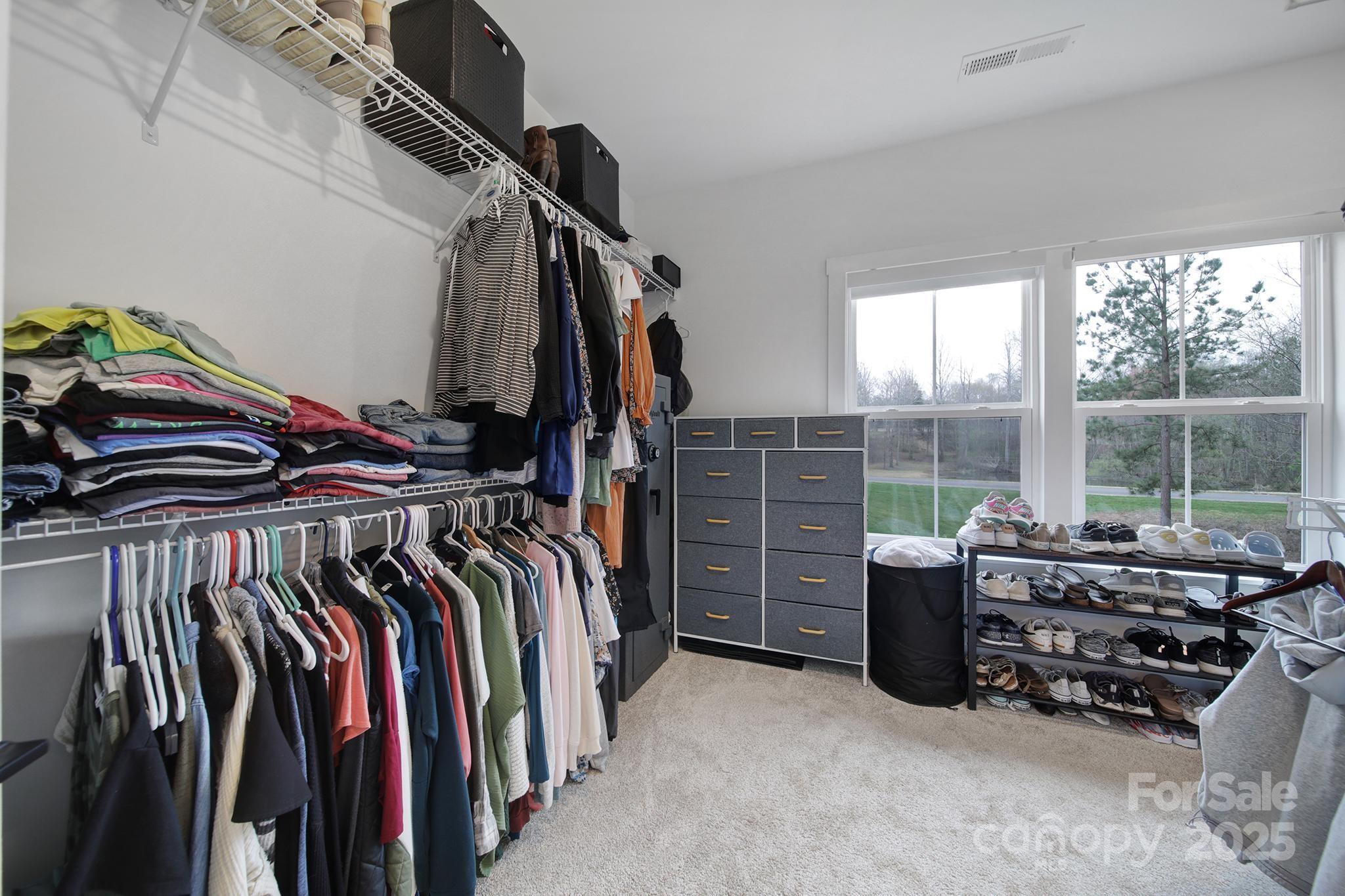 856 Bellegray Road Clover, SC 29710 - Photo 24 of 48 a view of walk in closet with clothes and shoes